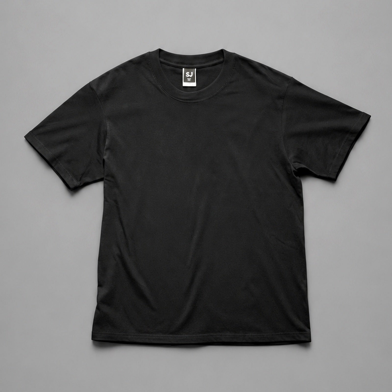 Black SJ Goods Tee front on a neutral gray background