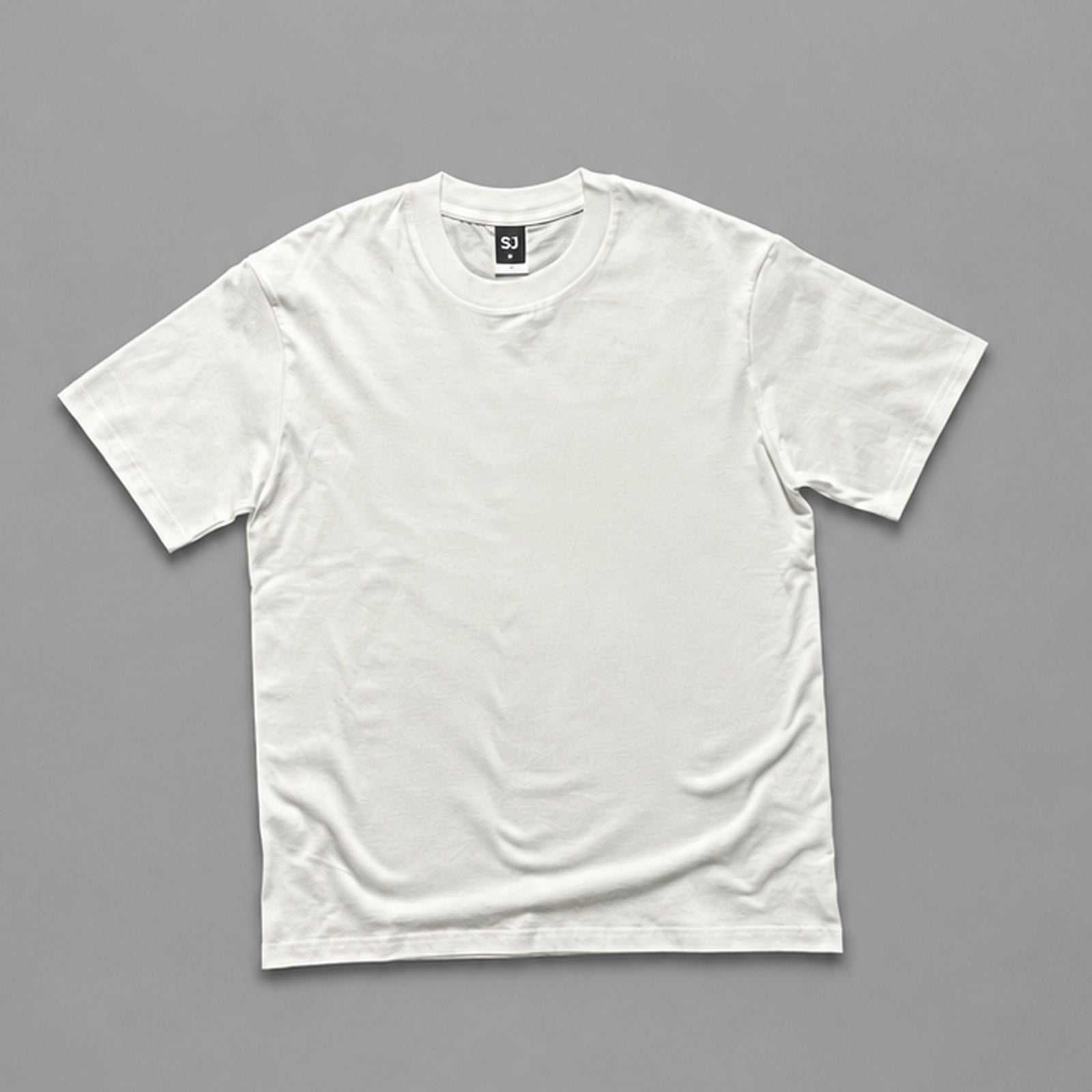 White SJ Goods Tee front on a neutral gray background